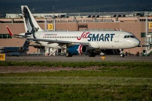 JetSMART Airbus A320 on the runway at Mendoza International Airport in Argentina.